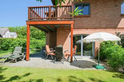 Ein Garten an der Unterkunft Dünenhof DÜNENHOF Whg. D-12