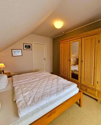 Ein Bett oder Betten in einem Zimmer der Unterkunft Strandstr.41 Fewo 2