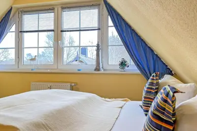 Ein Bett oder Betten in einem Zimmer der Unterkunft Ostseeauszeit