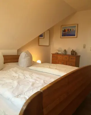 Ein Bett oder Betten in einem Zimmer der Unterkunft Strandstr.51 Wohnungsnr.11