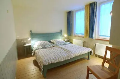 Ein Bett oder Betten in einem Zimmer der Unterkunft Ferienhaussiedlung Strandperlen Küstenhof 5a (Typ X)