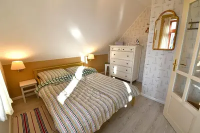 Ein Bett oder Betten in einem Zimmer der Unterkunft Ferienhaussiedlung Strandperlen Küstenhof 5b (Typ X)