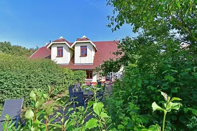 Ein Garten an der Unterkunft Ferienhaussiedlung Strandperlen Küstenhof 5b (Typ X)