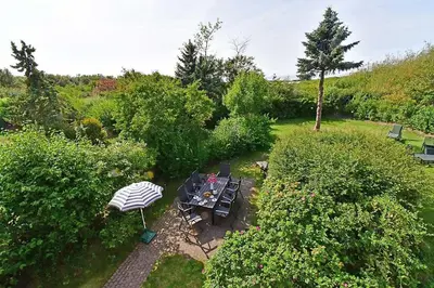 Ein Garten an der Unterkunft Ferienhaussiedlung Strandperlen Küstenhof 5b (Typ X)