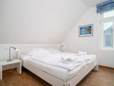 Ein Bett oder Betten in einem Zimmer der Unterkunft Haus SEEGARTEN