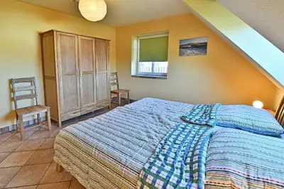 Ein Bett oder Betten in einem Zimmer der Unterkunft Haus EMMA WF 02 linke Haushälfte