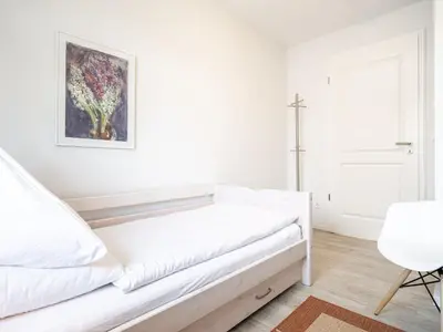 Ein Bett oder Betten in einem Zimmer der Unterkunft Haus STRANDHAFER WF-06 (links)