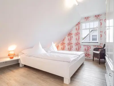 Ein Bett oder Betten in einem Zimmer der Unterkunft Haus STRANDHAFER WF-06 (links)