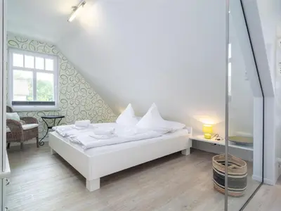 Ein Bett oder Betten in einem Zimmer der Unterkunft Haus STRANDHAFER WF-07 (rechts)