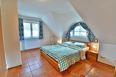 Ein Bett oder Betten in einem Zimmer der Unterkunft Ferienhaus An der alten Waldschänke WS-11a