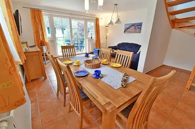 Ein Sitzbereich in der Unterkunft Ferienhaus An der alten Waldschänke WS-11a