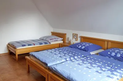 Ein Bett oder Betten in einem Zimmer der Unterkunft Ferienhaus das Blaue Haus WS-9a