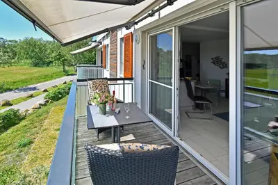 Ein Balkon oder eine Terrasse in der Unterkunft FeWo SEEWIESE