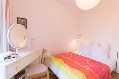 Ein Bett oder Betten in einem Zimmer der Unterkunft FeWo AN DER DÜNE EG-Whg. D46.1