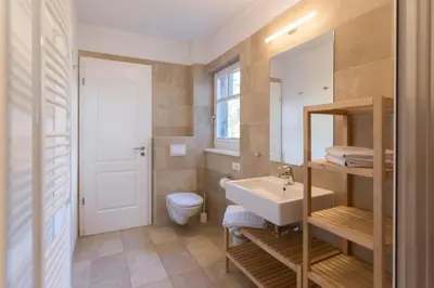 Ein Badezimmer in der Unterkunft FeWo AN DER DÜNE EG-Whg. D46.1