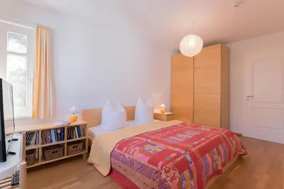 Ein Bett oder Betten in einem Zimmer der Unterkunft FeWo AN DER DÜNE DG-Whg. D46.2