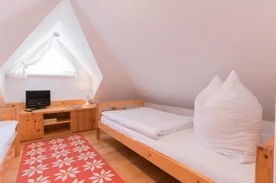 Ein Bett oder Betten in einem Zimmer der Unterkunft FeWo AN DER DÜNE DG-Whg. D46.2