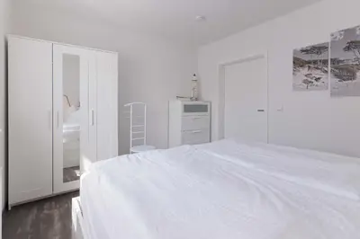 Ein Bett oder Betten in einem Zimmer der Unterkunft Born - Wieck DAT SCHWEDENHUS EG-Whg. WI-4.1