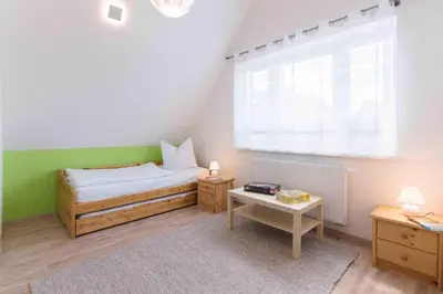Ein Bett oder Betten in einem Zimmer der Unterkunft Haus DE LOOP