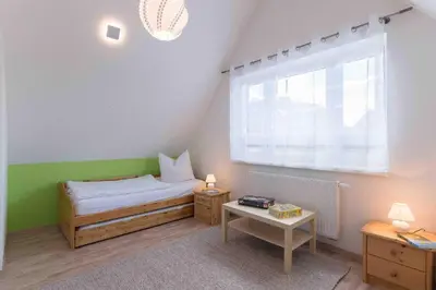 Ein Bett oder Betten in einem Zimmer der Unterkunft Haus DE LOOP