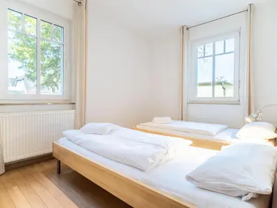 Ein Bett oder Betten in einem Zimmer der Unterkunft Grüne Straße FeWo G1 (EG links)