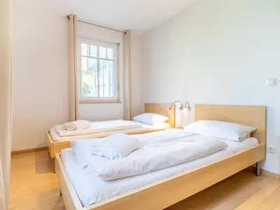 Ein Bett oder Betten in einem Zimmer der Unterkunft Grüne Straße FeWo G1 (EG links)