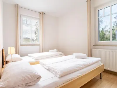 Ein Bett oder Betten in einem Zimmer der Unterkunft Grüne Straße FeWo G2 (EG rechts)