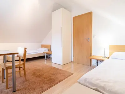 Ein Bett oder Betten in einem Zimmer der Unterkunft Grüne Straße FeWo G3 (DG links)