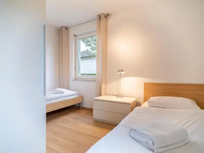 Ein Bett oder Betten in einem Zimmer der Unterkunft Grüne Straße FeWo G5 (EG links)
