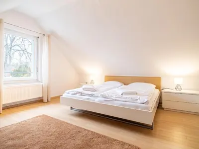 Ein Bett oder Betten in einem Zimmer der Unterkunft Grüne Straße FeWo G8 (DG rechts)