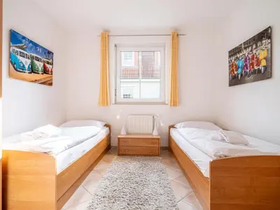 Ein Bett oder Betten in einem Zimmer der Unterkunft Schulstraße FeWo S1 (EG rechts)
