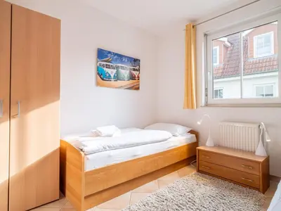 Ein Bett oder Betten in einem Zimmer der Unterkunft Schulstraße FeWo S1 (EG rechts)