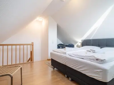 Ein Bett oder Betten in einem Zimmer der Unterkunft Schulstraße FeWo S3 (DG rechts)