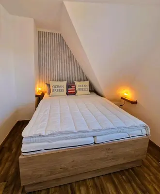 Ein Bett oder Betten in einem Zimmer der Unterkunft Wiesenstr. FeWo Kirr