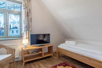 Ein Bett oder Betten in einem Zimmer der Unterkunft Ferienhaussiedlung Strandperlen Buchenhof 2a (Typ VIII)