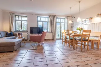Ein Sitzbereich in der Unterkunft Ferienhaussiedlung Strandperlen Buchenhof 2b (Typ VI)
