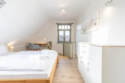 Ein Bett oder Betten in einem Zimmer der Unterkunft Ferienhaussiedlung Strandperlen Buchenhof 2d (Typ I)