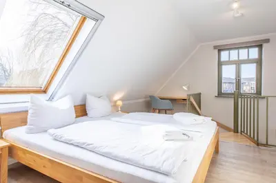 Ein Bett oder Betten in einem Zimmer der Unterkunft Ferienhaussiedlung Strandperlen Buchenhof 2d (Typ I)