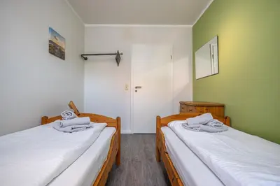 Ein Bett oder Betten in einem Zimmer der Unterkunft Strandoase Typ STO-A STRANDOASE Whg. SO2