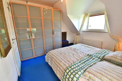 Ein Bett oder Betten in einem Zimmer der Unterkunft Strandoase Typ STO-A STRANDOASE Whg. SO8