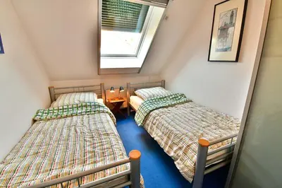 Ein Bett oder Betten in einem Zimmer der Unterkunft Strandoase Typ STO-A STRANDOASE Whg. SO8