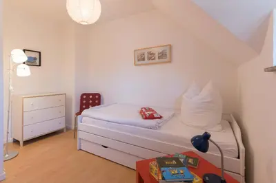 Ein Bett oder Betten in einem Zimmer der Unterkunft STRANDHAUS 43