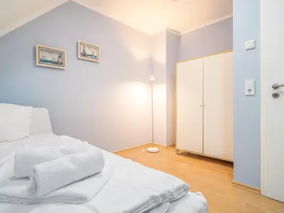Ein Bett oder Betten in einem Zimmer der Unterkunft STRANDHAUS 43a
