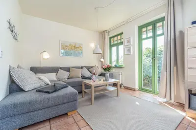 Ein Sitzbereich in der Unterkunft Ferienhaussiedlung Strandperlen Küstenhof 1a (Typ IV)