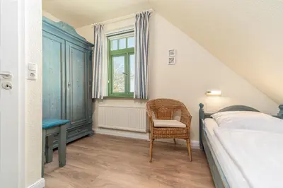 Ein Bett oder Betten in einem Zimmer der Unterkunft Ferienhaussiedlung Strandperlen Küstenhof 1a (Typ IV)