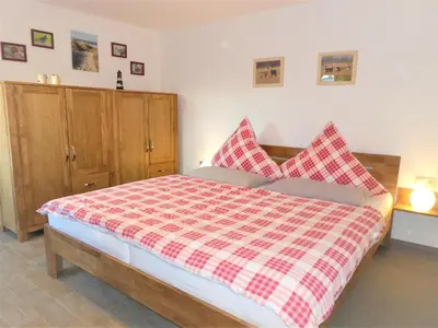 Ein Bett oder Betten in einem Zimmer der Unterkunft FeWo Leuchtturm - Heuser Prerow