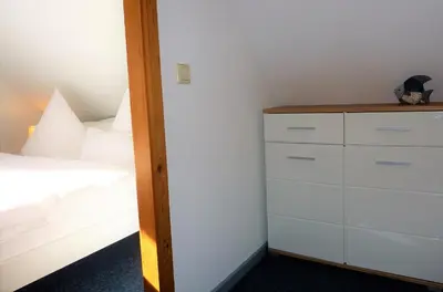 Ein Bett oder Betten in einem Zimmer der Unterkunft FeWo Eibe - Ulenhoef