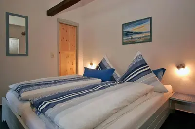 Ein Bett oder Betten in einem Zimmer der Unterkunft FeWo Erle - Ulenhoef
