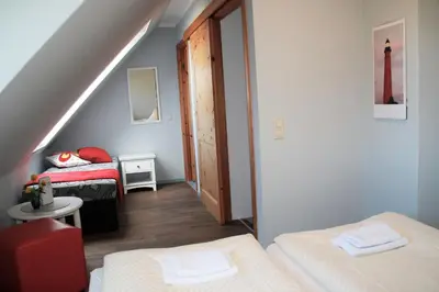 Ein Bett oder Betten in einem Zimmer der Unterkunft FeWo Eiche - Ulenhoef