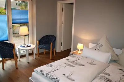 Ein Bett oder Betten in einem Zimmer der Unterkunft FeWo Kastanie - Ulenhoef